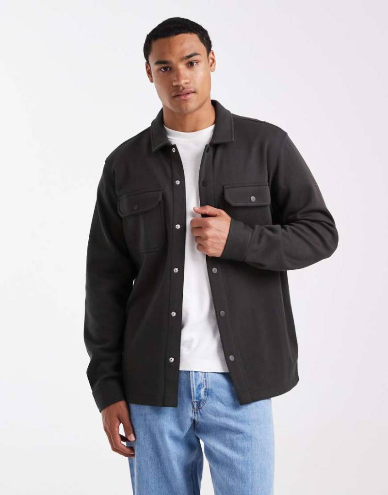 Threadbare - Hemdjacke in Dunkelgrün mit Knopfleiste und Vordertaschen Threadbare - Hemdjacke in Dunkelgrün mit Knopfleiste und Vordertaschen von Threadbare