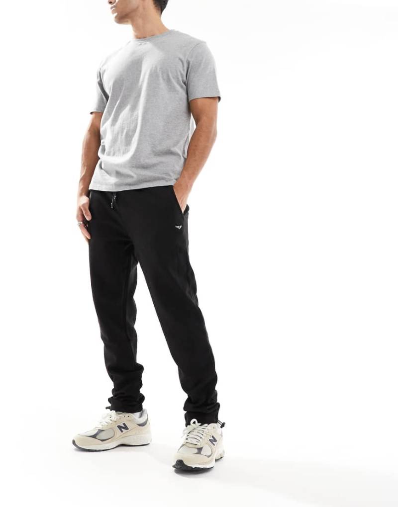 Threadbare - Jogginghose in Schwarz mit verstellbarem Knöchelsaum mit Knebelknopf von Threadbare
