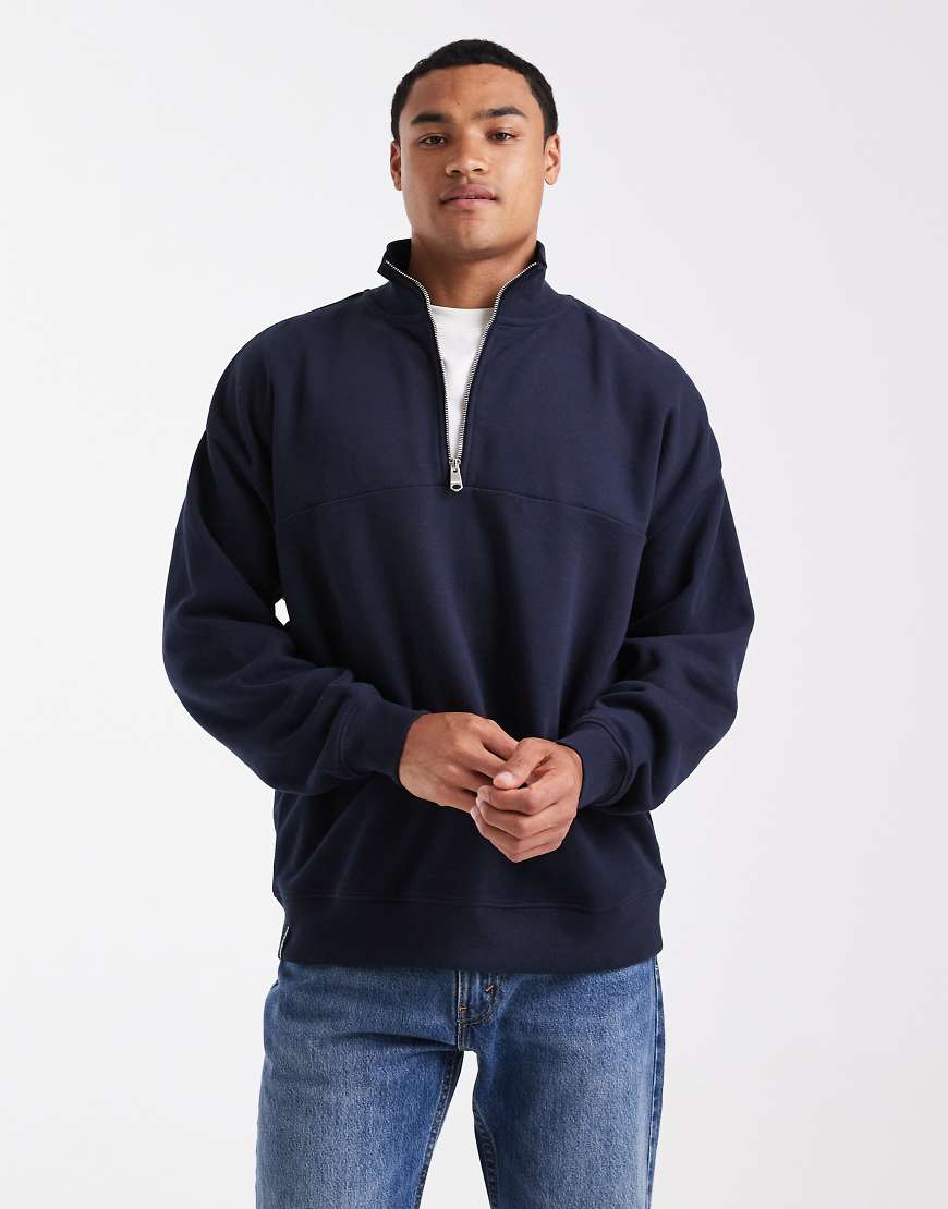 Threadbare - Lockeres Fleece-Sweatshirt in Marineblau mit kurzem Reißverschluss Threadbare - Lockeres Fleece-Sweatshirt in Marineblau mit kurzem Reißverschluss von Threadbare