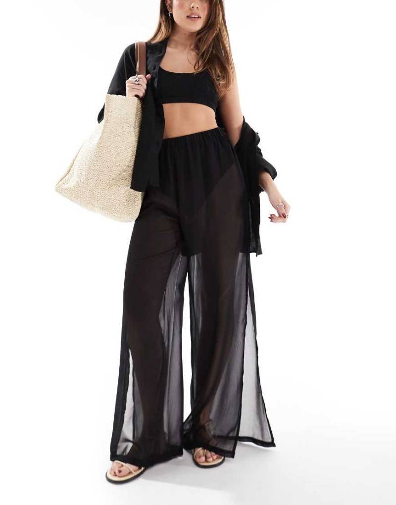 Threadbare - Weit geschnittene, transparente Strandhose in Schwarz mit seitlichem Schlitz von Threadbare