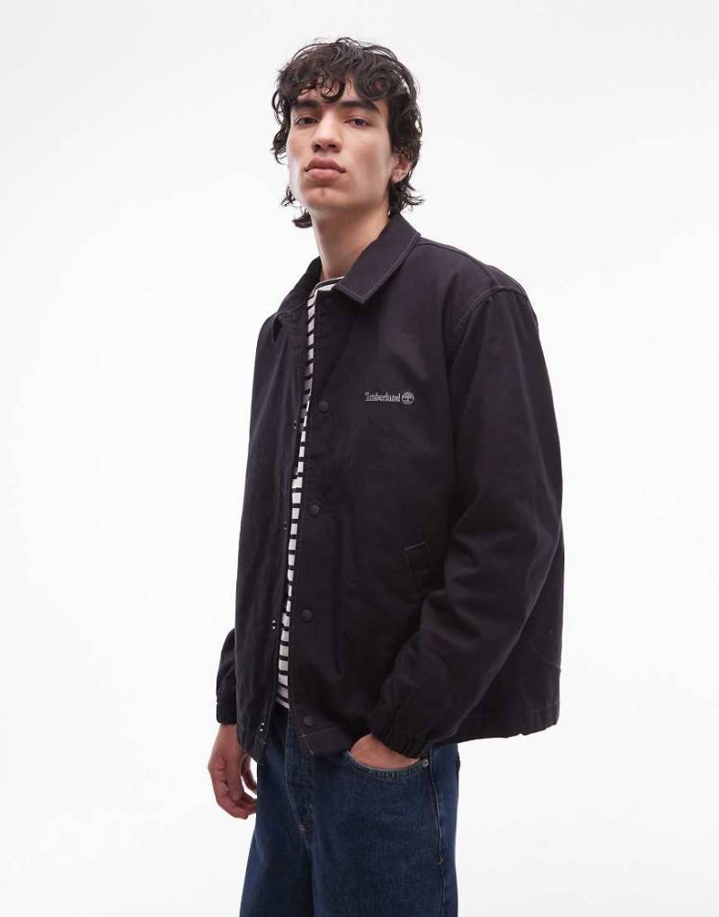 Timberland - Gefütterte Coachjacke aus gewaschenem Canvas in Schwarz von Timberland