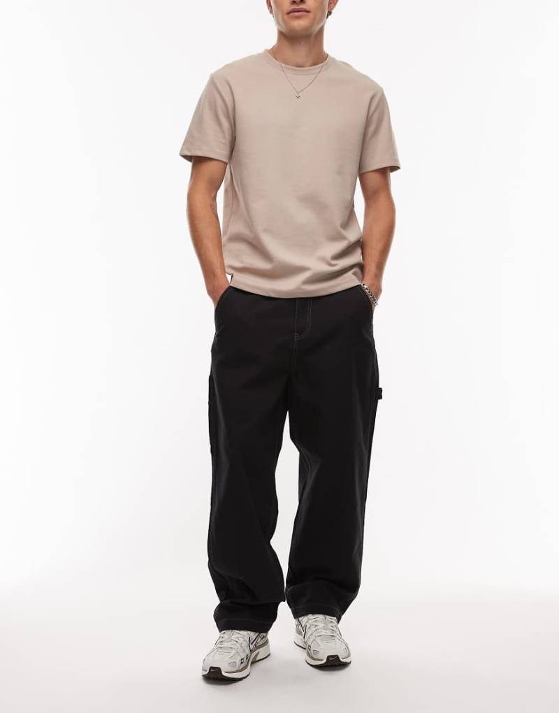Timberland - Locker sitzende Carpenter-Hose aus schwerem Canvas in Schwarz mit Taschen Timberland - Locker sitzende Carpenter-Hose aus schwerem Canvas in Schwarz mit Taschen von Timberland
