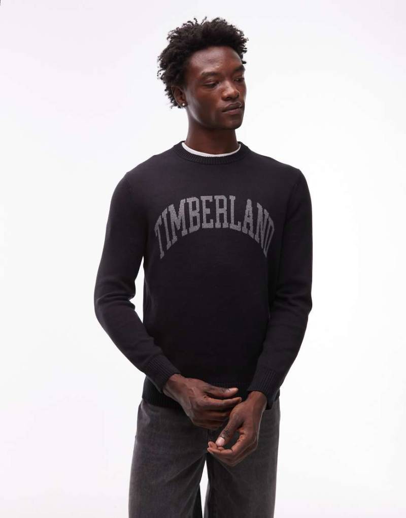 Timberland - Rundhals-Strickpullover in Schwarz mit College-Logo auf der Brust von Timberland