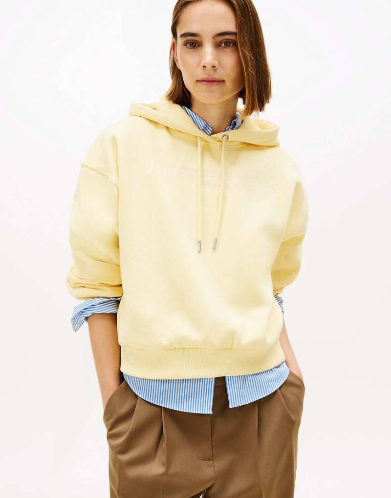 Tommy Hilfiger - Flex - Locker geschnittener Fleece-Kapuzenpullover in Hellgelb mit Logo-Stickerei von Tommy Hilfiger