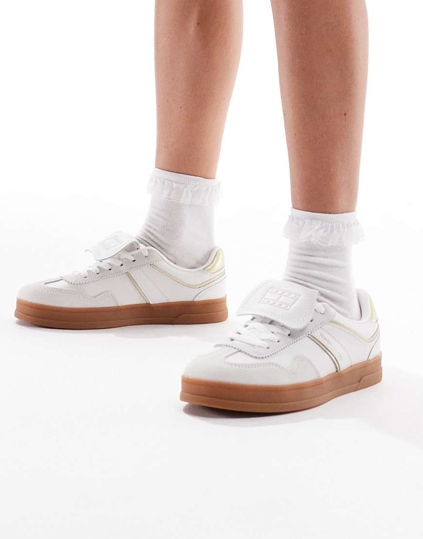 Tommy Jeans - Greenwich - Sneaker in Weiß und Gold mit Gummisohle Tommy Jeans - Greenwich - Sneaker in Weiß und Gold mit Gummisohle von Tommy Jeans
