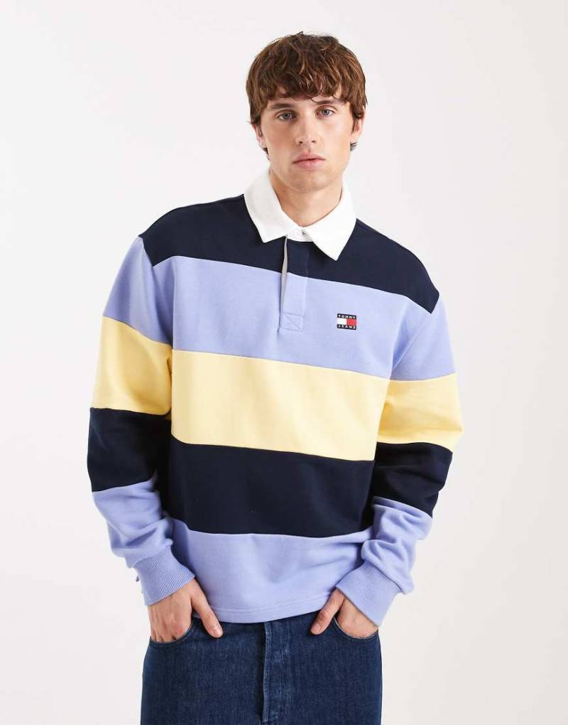 Tommy Jeans - Locker geschnittenes Rugby-Sweatshirt in Marineblau/Flieder/Gelb gestreift von Tommy Jeans