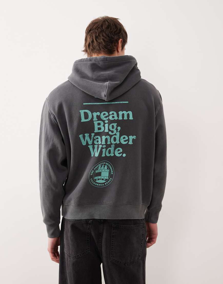 Tommy Jeans - Relaxed-Fit-Kapuzenpullover in verwaschenem Schwarz mit Grafiklogo auf der Brust von Tommy Jeans