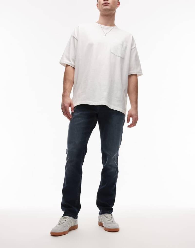 Tommy Jeans - Scanton - Schmal geschnittene Jeans in dunkler Waschung-Blau von Tommy Jeans