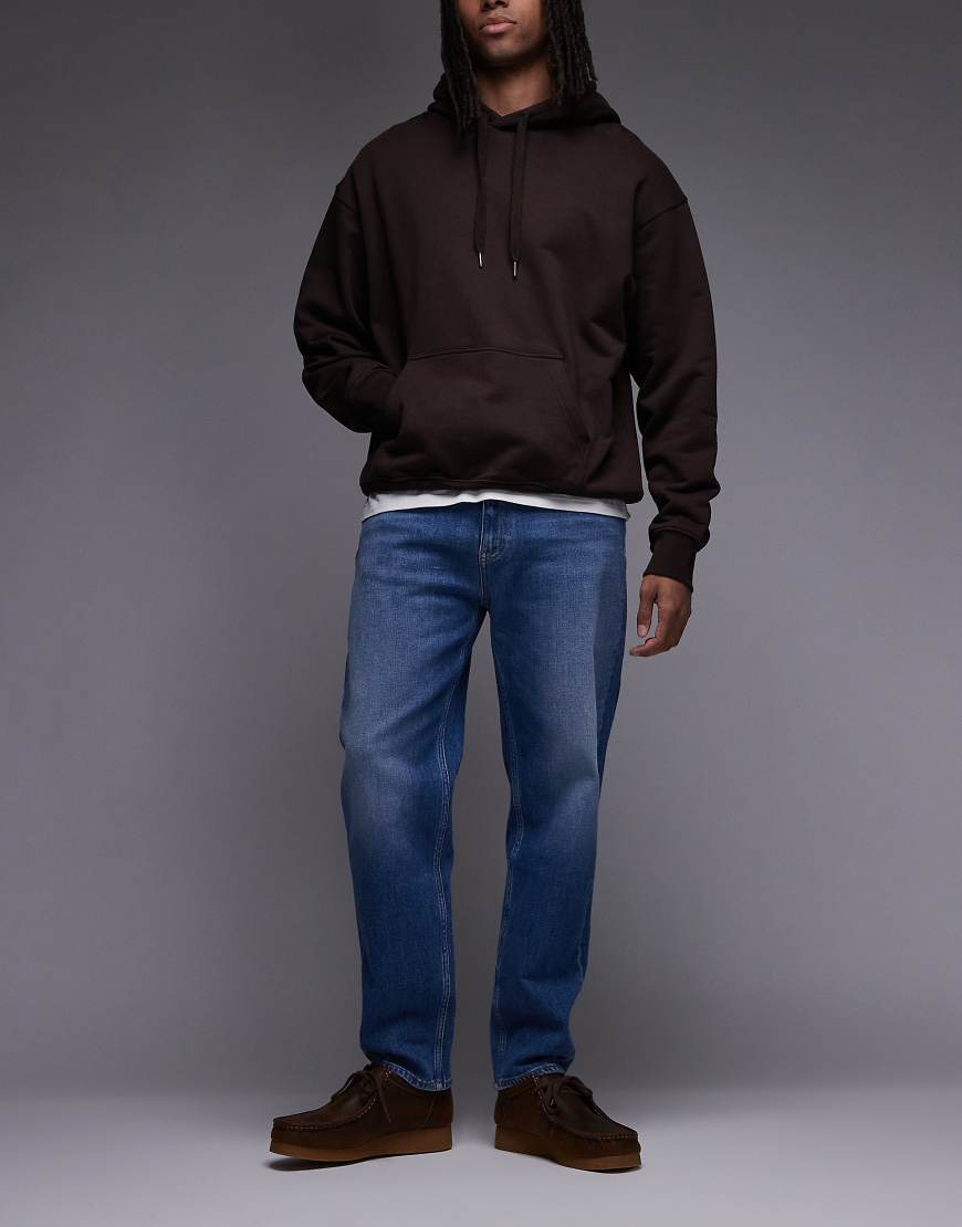 Tommy Jeans - Sonny - Schmal zulaufende Regular-Fit-Jeans in mittlerer Waschung-Blau von Tommy Jeans