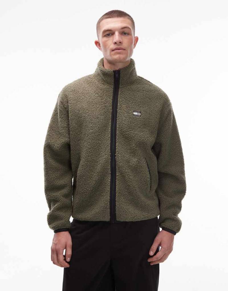 Tommy Jeans - Teddy-Jacke in Dunkelgrün mit Logo-Aufnäher und durchgehendem Reißverschluss von Tommy Jeans