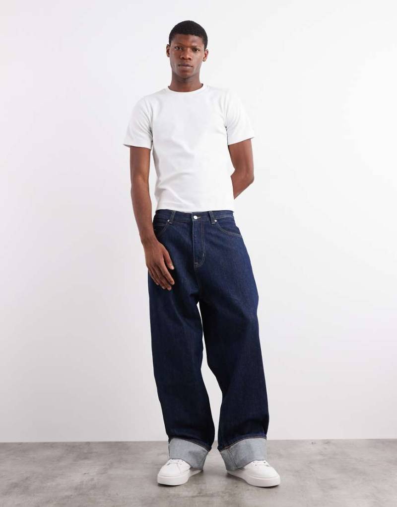 Tommy Jeans - Theo - Baggy Jeans in dunkler Waschung mit Umschlag-Design-Blau von Tommy Jeans