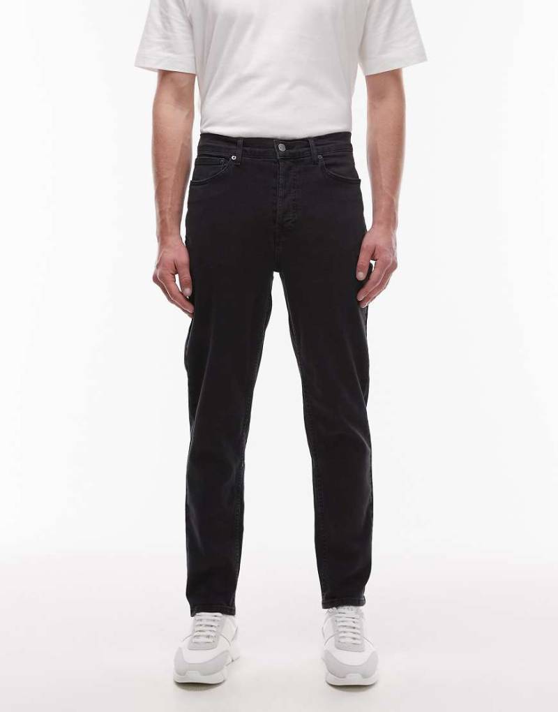 Topman - Elastische, schmal zulaufende Jeans in verwaschenem Schwarz von Topman