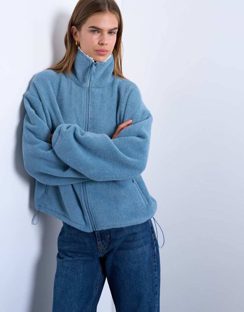 Topshop - Jacke aus Teddyfleece in Blau mit durchgehendem Reißverschluss und Stehkragen von Topshop