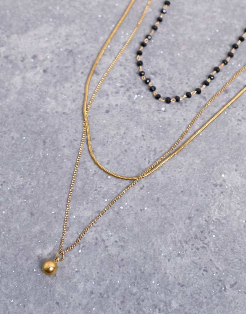 Topshop - Maddox - Mehrreihige, goldfarbene Halskette aus Edelstahl mit schwarzen Perlen von Topshop