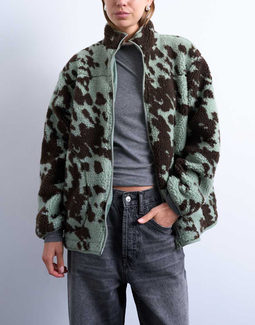 Topshop - Teddyfleece-Jacke mit Kuhfleckenmuster in Braun und Petrol und kontrastierender Einfassung in Petrol-Bunt von Topshop
