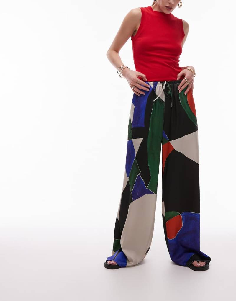 Topshop - Weite Hose aus Satin mit Kordelzug und geometrischem Muster in Orange und Blau von Topshop