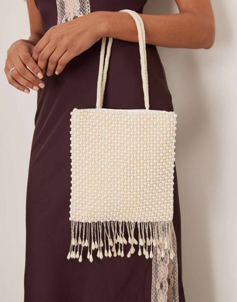 True Decadence - Tasche in Weiß mit Perlenverzierung und Quastendetails von True Decadence