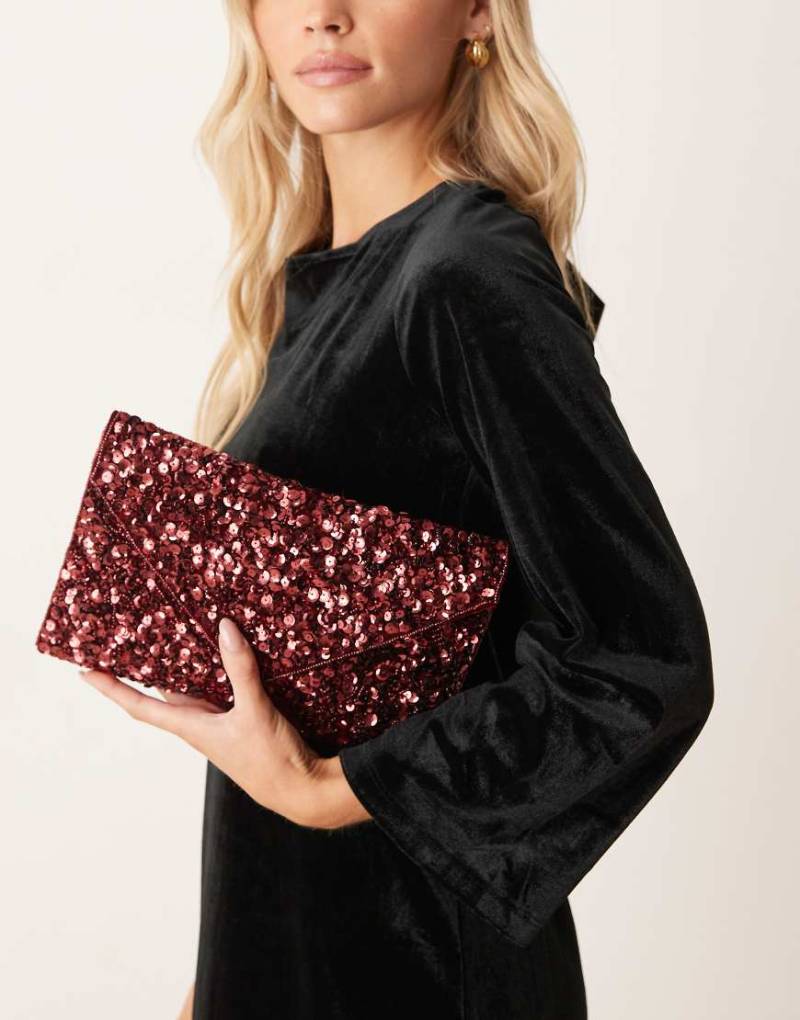 True Decadence - Umschlag-Clutch in Burgunderrot mit All-over-Paillettenbesatz von True Decadence