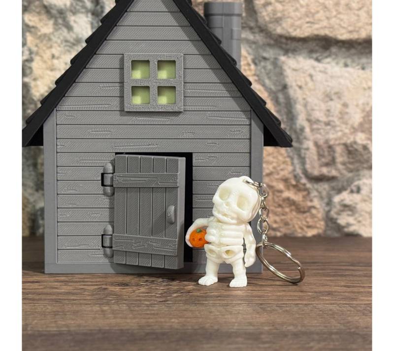 UDINGO Schlüsselanhänger Mini-Skelett mit Kürbis UDINGO Schlüsselanhänger Mini-Skelett mit Kürbis von UDINGO