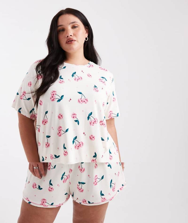Urban Threads Curve - Pyjama in Rosa mit Discokugel-Kirschmuster von Urban Threads