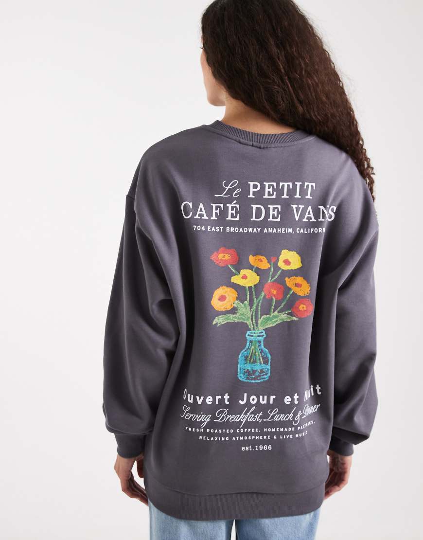 Vans - Oversize-Kapuzenpullover in Asphaltgrau mit „Café de Vans"-Print-Schwarz Vans - Oversize-Kapuzenpullover in Asphaltgrau mit „Café de Vans"-Print-Schwarz von Vans