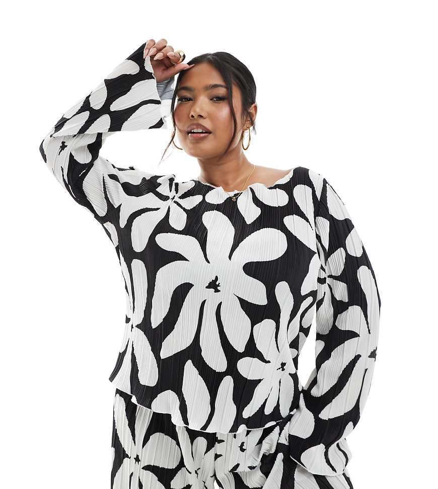 Vero Moda Curve - Langärmliges, plissiertes Oberteil in Schwarz mit U-Boot-Ausschnitt und weißem Blumenmuster Vero Moda Curve - Langärmliges, plissiertes Oberteil in Schwarz mit U-Boot-Ausschnitt und weißem Blumenmuster von Vero Moda Curve
