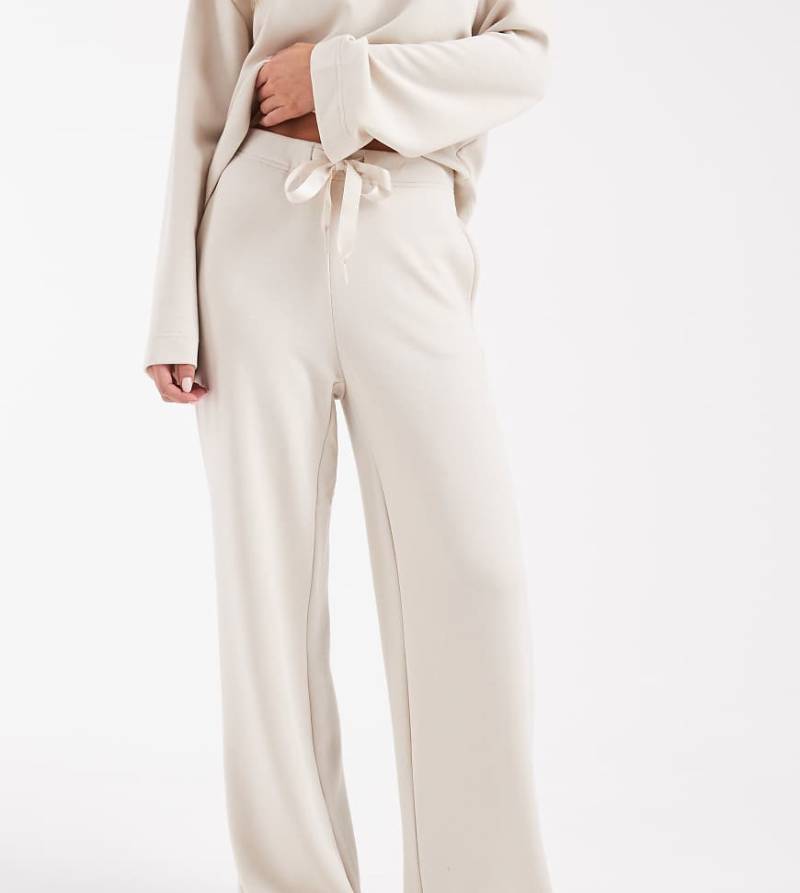 Vero Moda Petite - Superweiche Jogginghose in Creme mit Bindeband an der Taille und weitem Bein, Kombiteil-Weiß Vero Moda Petite - Superweiche Jogginghose in Creme mit Bindeband an der Taille und weitem Bein, Kombiteil-Weiß von Vero Moda Petite