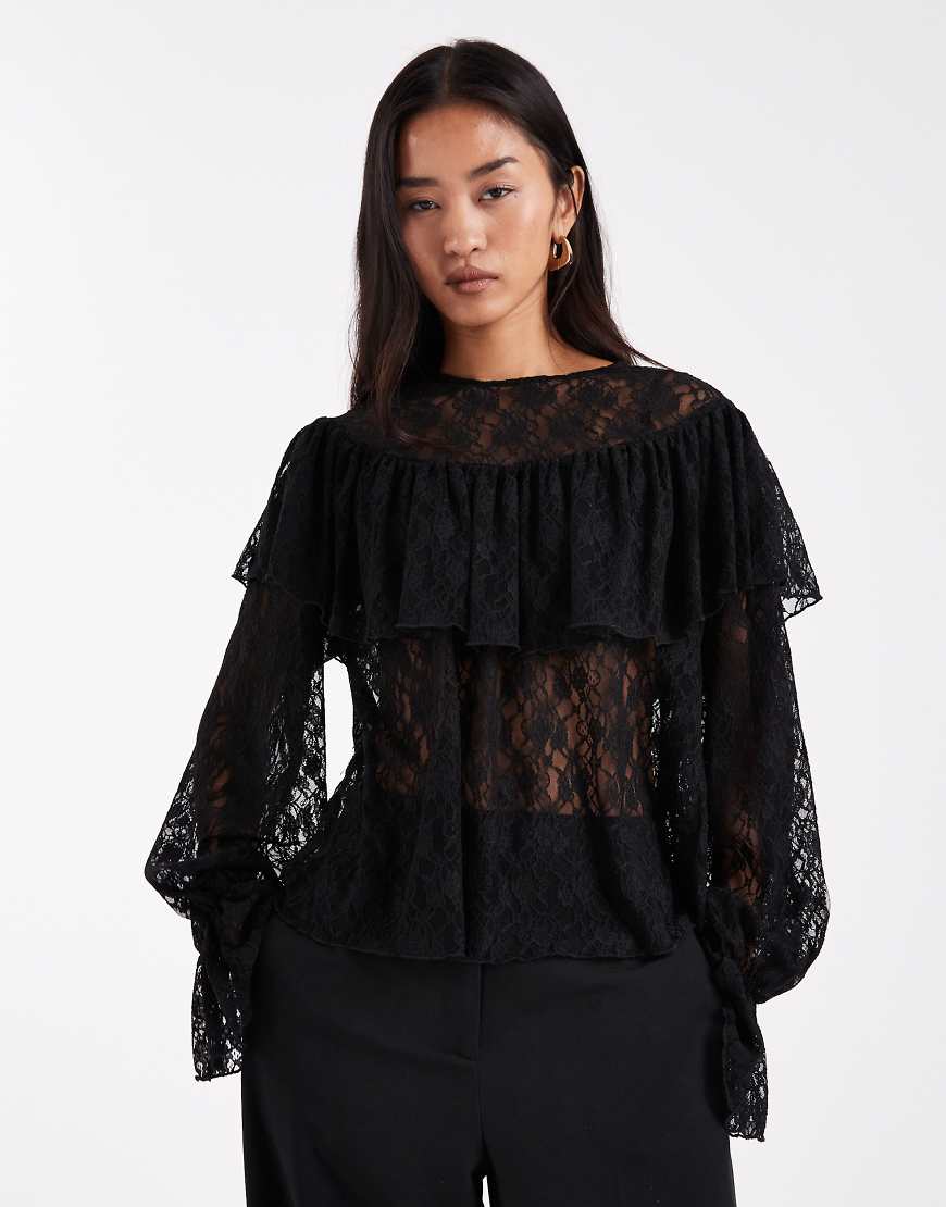 Vero Moda - Bluse aus durchscheinender Spitze in Schwarz mit Volantärmeln von Vero Moda