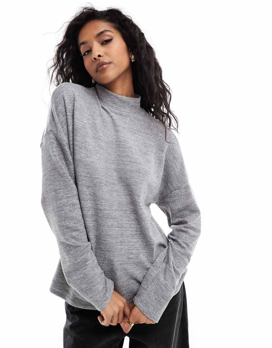 Vero Moda - Hochgeschlossenes Jersey-Oberteil in meliertem Hellgrau mit Oversize-Schnitt Vero Moda - Hochgeschlossenes Jersey-Oberteil in meliertem Hellgrau mit Oversize-Schnitt von Vero Moda