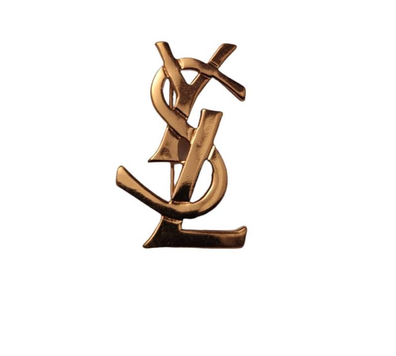 Yves Saint Laurent - Große Logobrosche Aus Goldenem Metall Vintage 80Er Yves Saint Laurent - Große Logobrosche Aus Goldenem Metall Vintage 80Er von VintageStorie