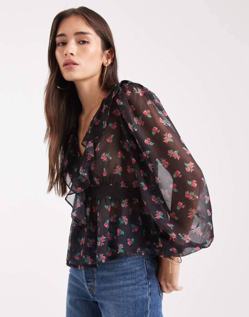 Wednesday's Girl - Fließendes, langärmliges Oberteil in Schwarz mit Blumenmuster, V-Ausschnitt und Rüschen-Detail-Weiß von Wednesday's Girl