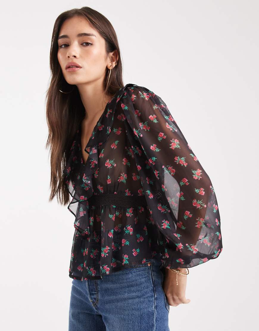 Wednesday's Girl - Fließendes, langärmliges Oberteil in Schwarz mit Blumenmuster, V-Ausschnitt und Rüschen-Detail-Weiß von Wednesday's Girl