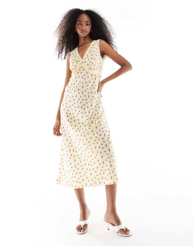 Wednesday's Girl - Midikleid in Gelb mit V-Ausschnitt und Blümchenmuster von Wednesday's Girl