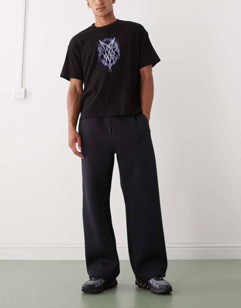 Weekday - Jogginghose aus Material in Neoprenoptik in dunklem Marineblau mit weitem Bein von Weekday