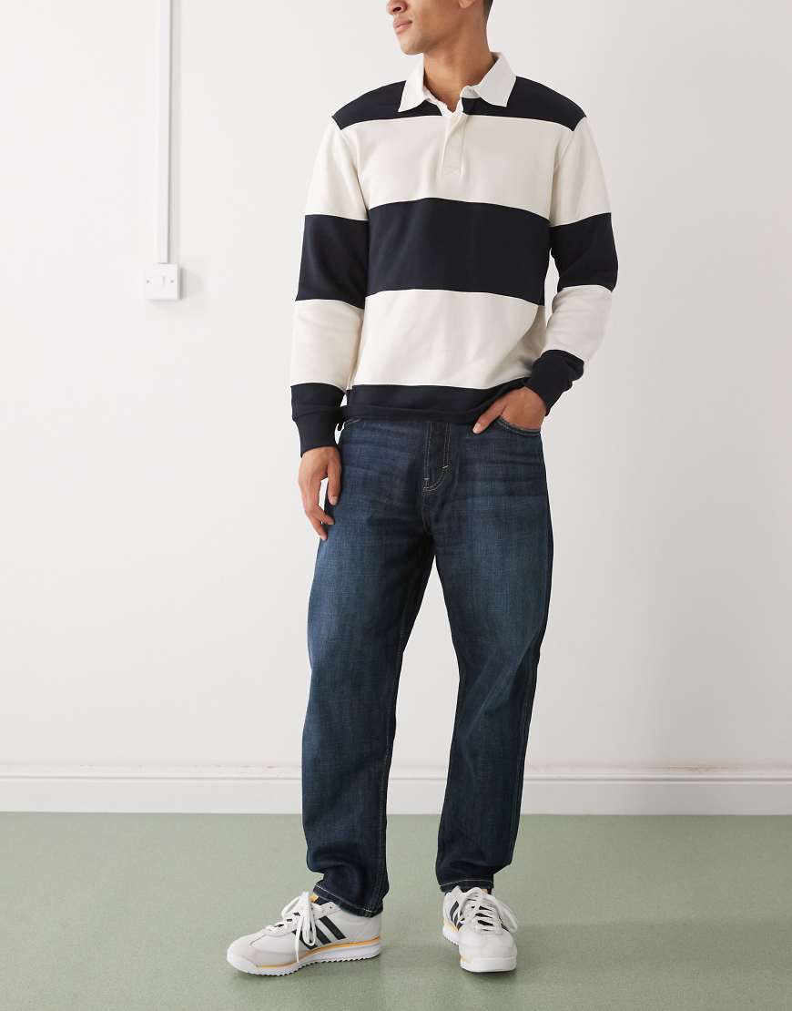 Weekday - Ray - Locker geschnittene Jeans in Dunkelblau mit schmal zulaufendem Bein Weekday - Ray - Locker geschnittene Jeans in Dunkelblau mit schmal zulaufendem Bein von Weekday