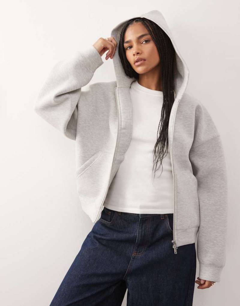 Weekday - Scarlet - Oversize-Kapuzenjacke aus neoprenartigem Material in Grau meliert mit durchgehendem Reißverschluss Weekday - Scarlet - Oversize-Kapuzenjacke aus neoprenartigem Material in Grau meliert mit durchgehendem Reißverschluss von Weekday