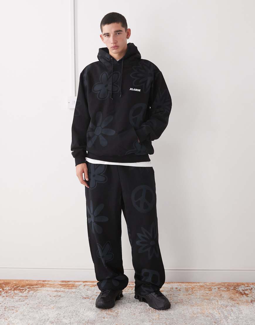 XLarge - Jogginghose in Schwarz mit elastischem Bund und Peace- und Logoprint, Kombiteil von Xlarge