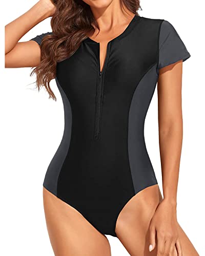 Yonique Damen-Badeanzug, kurzärmelig, Rashguard, einteilig, Reißverschluss, Badeanzug, Surfen, Bademode, UPF 50+, schwarz / grau, Medium von Yonique