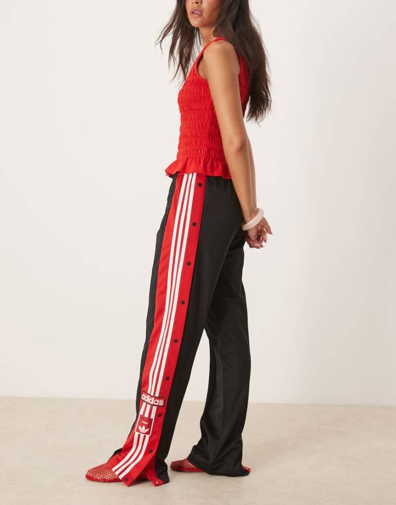 adidas Originals - Adibreak - Trainingshose in Schwarz und Rot von adidas Originals