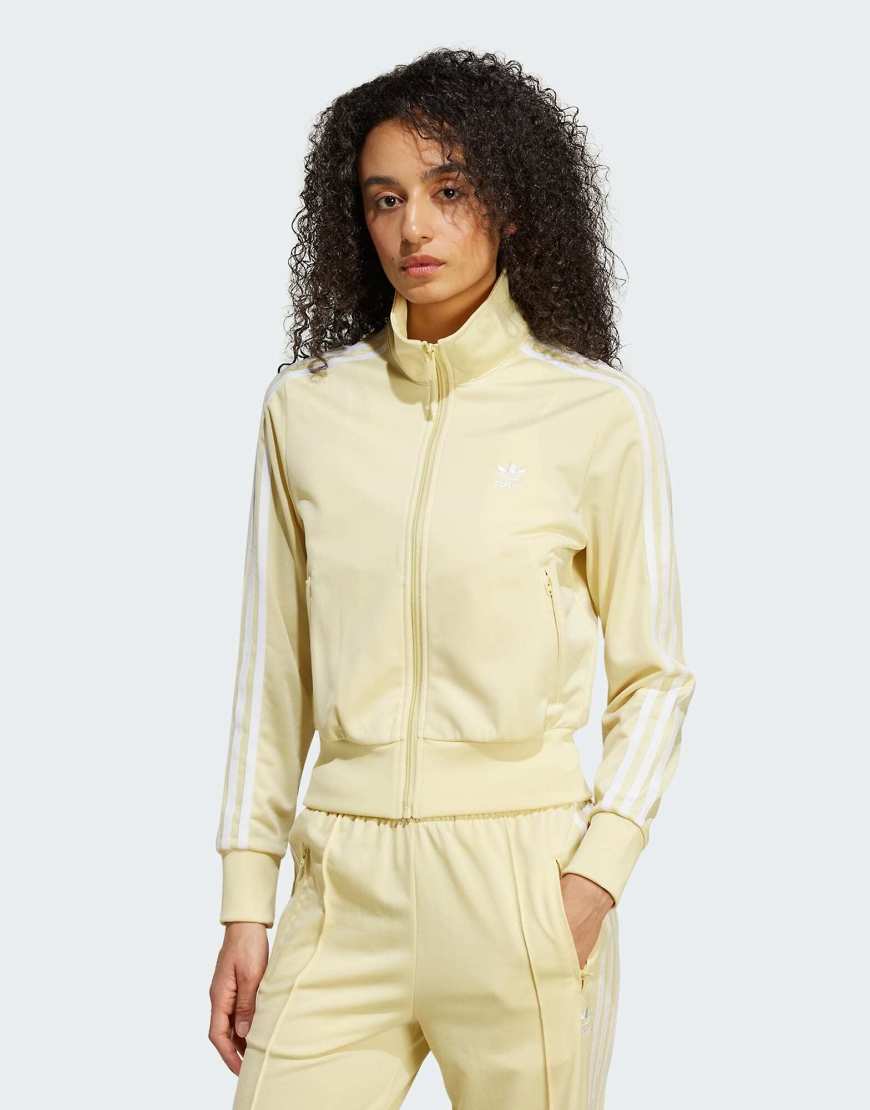 adidas Originals - Adicolor Classics Firebird - Trainingsoberteil in Pudergelb adidas Originals - Adicolor Classics Firebird - Trainingsoberteil in Pudergelb von adidas Originals