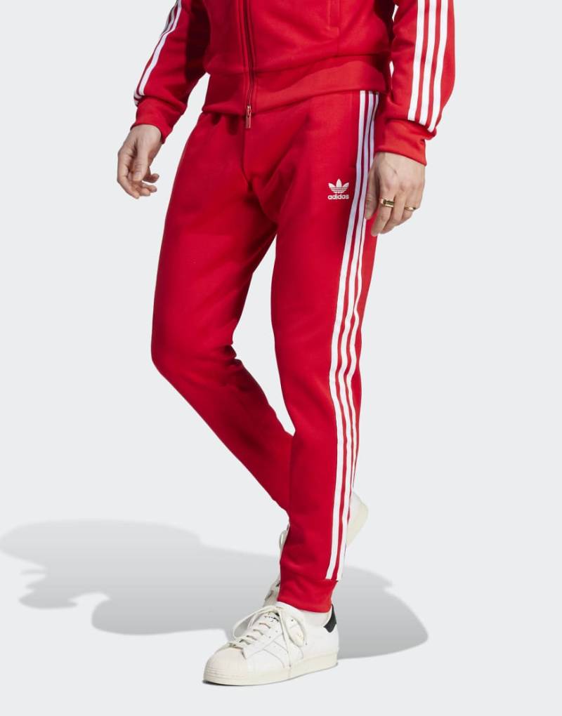 adidas Originals - Adicolor Classics SST - Trainingshose in Better Scarlet/Weiß-Rot von adidas Originals