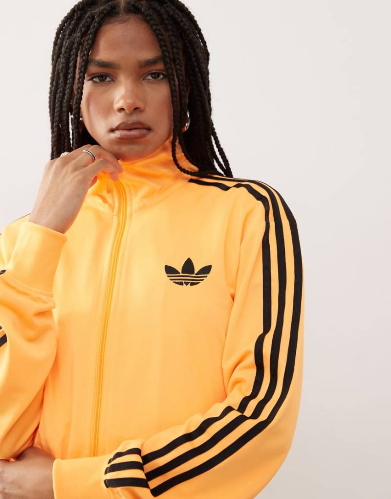 adidas Originals - Firebird Loose - Locker sitzende Trainingsjacke in Flash-Orange und Schwarz von adidas Originals