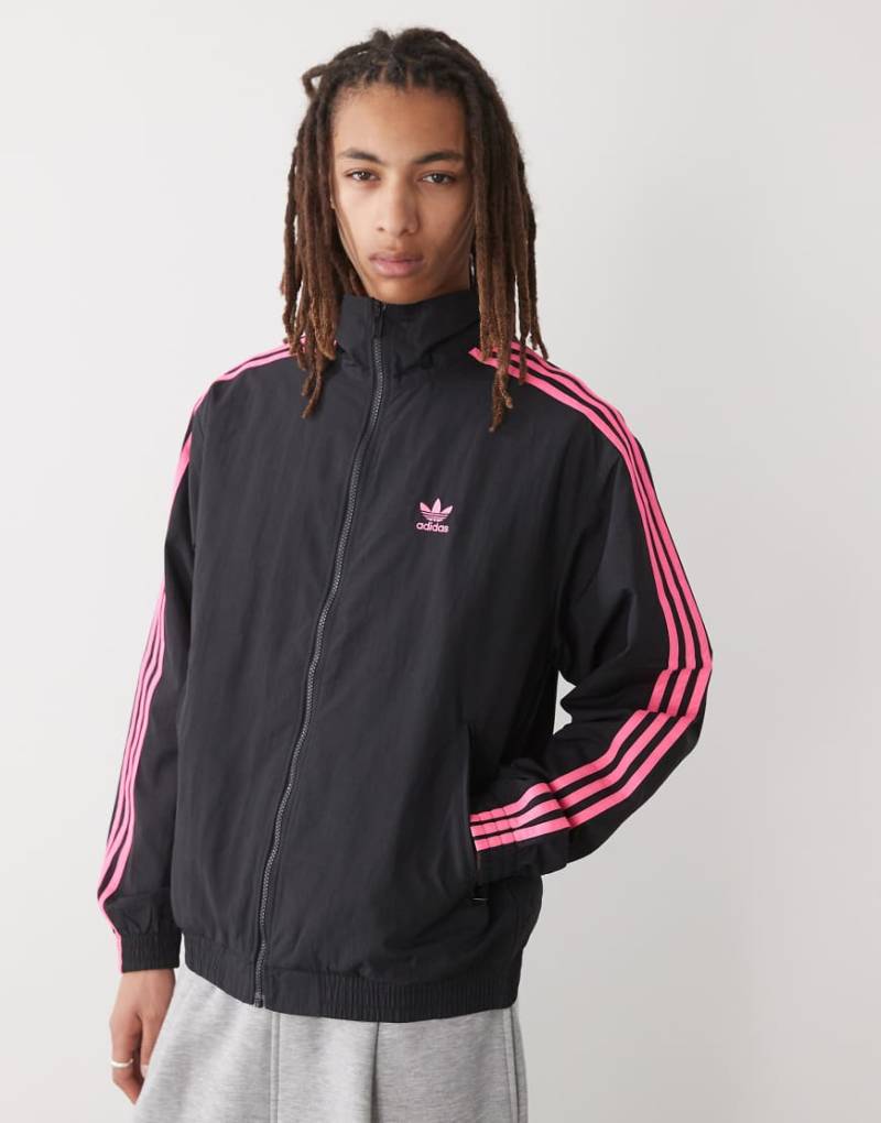 adidas Originals - Firebird - Trainingsjacke in Schwarz und leuchtendem Rosa von adidas Originals