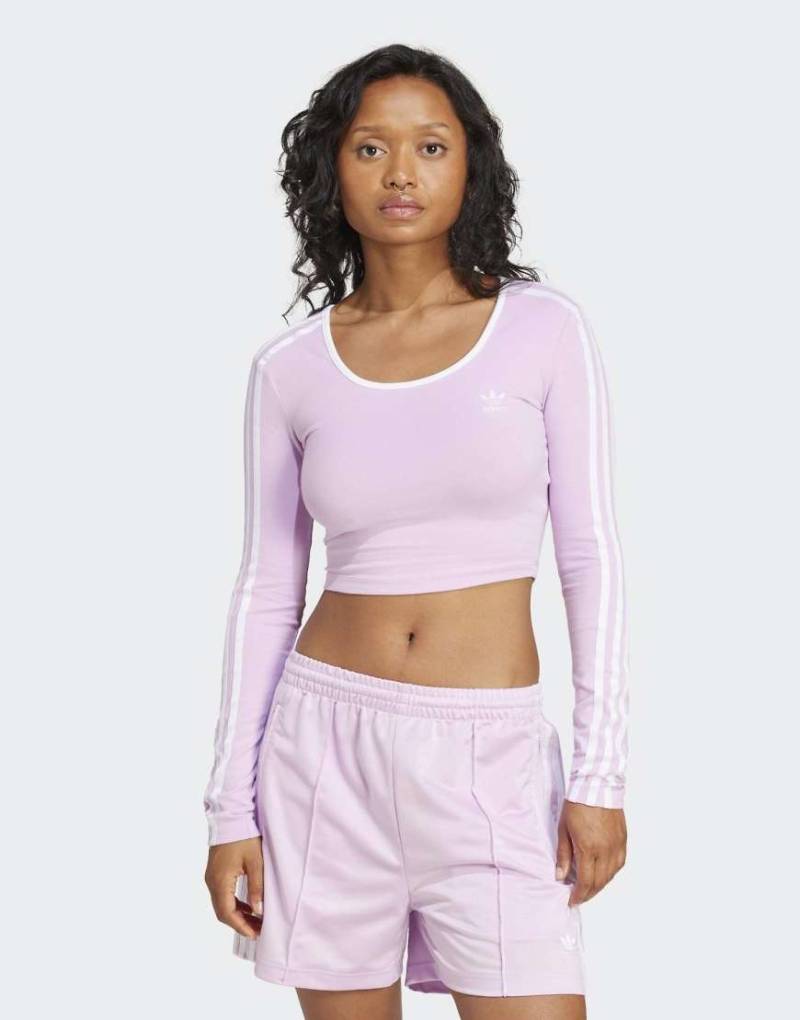 adidas Originals - Adicolor - Langärmliges Cropped-T-Shirt in Light Orchid mit 3-Streifen-Logo-Rosa adidas Originals - Adicolor - Langärmliges Cropped-T-Shirt in Light Orchid mit 3-Streifen-Logo-Rosa von adidas Originals