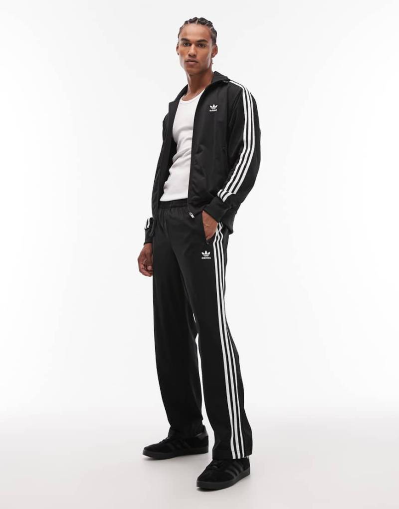 adidas Originals - Firebird - Loose Fit Trainingshose in Schwarz von adidas Originals