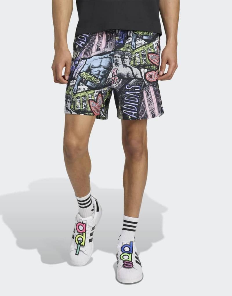 adidas Originals - Adidas x Jeremy Scott - Mehrfarbige Shorts mit All-over-Muster-Bunt adidas Originals - Adidas x Jeremy Scott - Mehrfarbige Shorts mit All-over-Muster-Bunt von adidas Originals