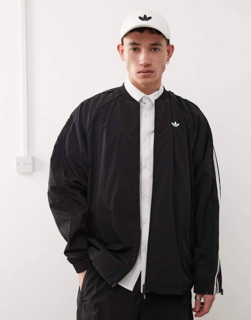 adidas Originals - Adilenium Season 3 - Trainingsjacke in Schwarz von adidas Originals