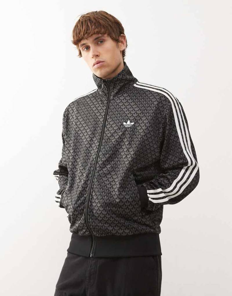 adidas Originals - Firebird - Loose-Fit-Trainingsjacke in Schwarz mit Monogramm-Muster von adidas Originals