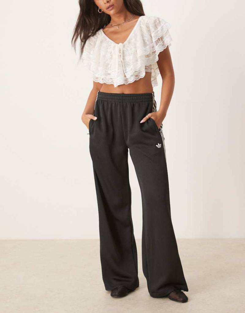 adidas Originals - Firebird - Trainingshose aus Strick in Schwarz von adidas Originals