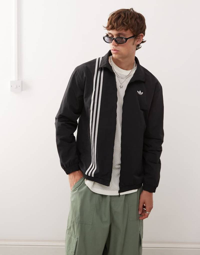 adidas Originals - Firebird - Trainingsjacke in Schwarz mit Streifen vorne von adidas Originals